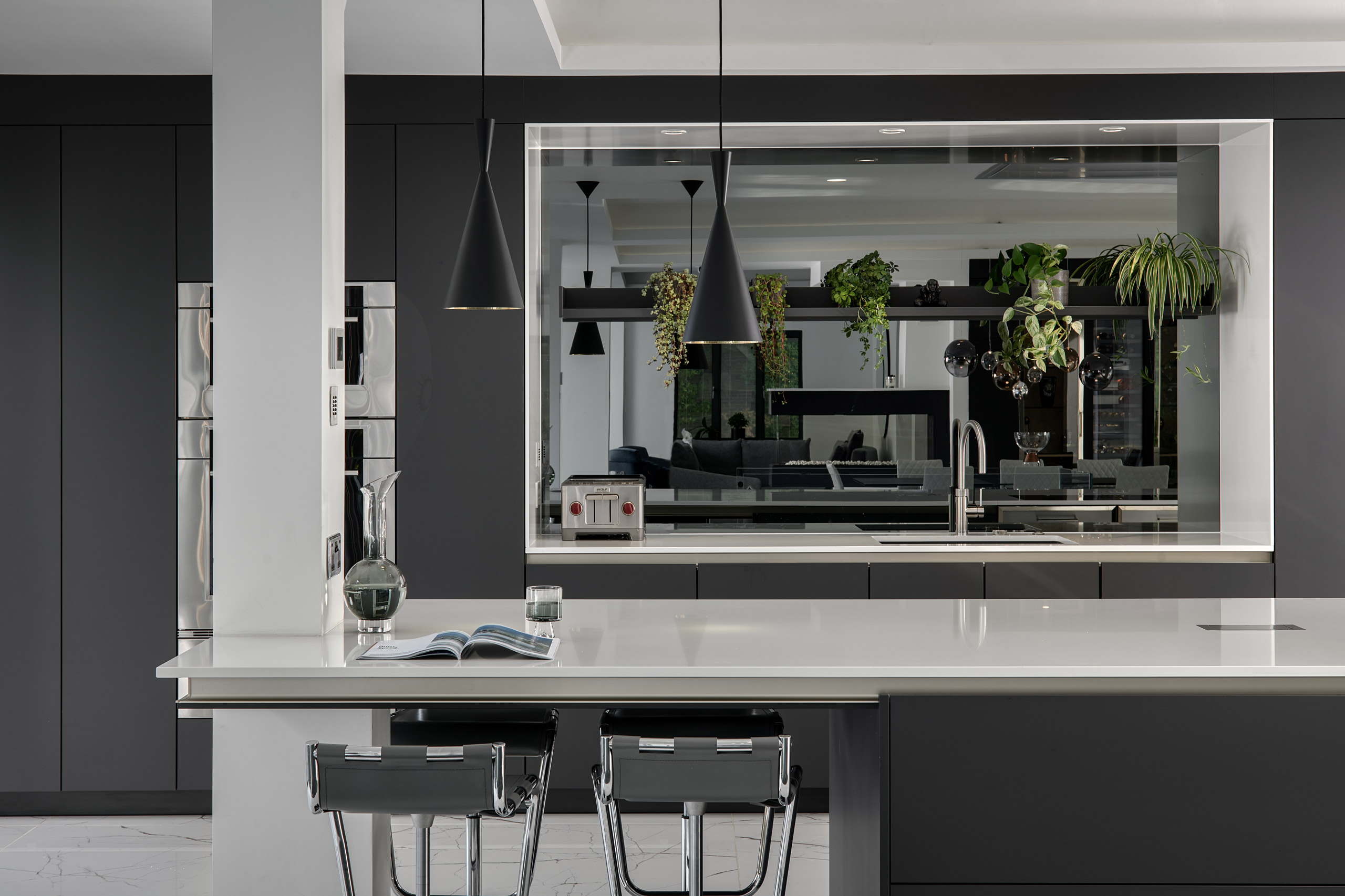 Modern Open Plan Kitchen in Hampshire with Grey Mirror splash back | The Myers Touch